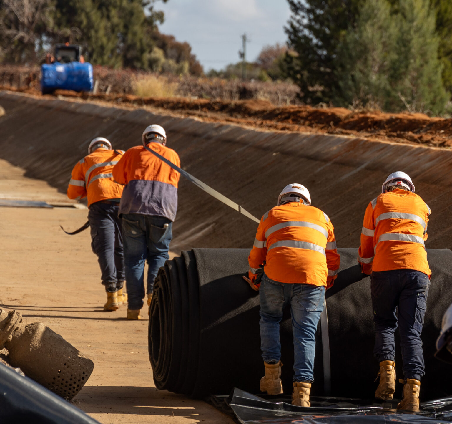 Contractor starting to lay the channel lining 