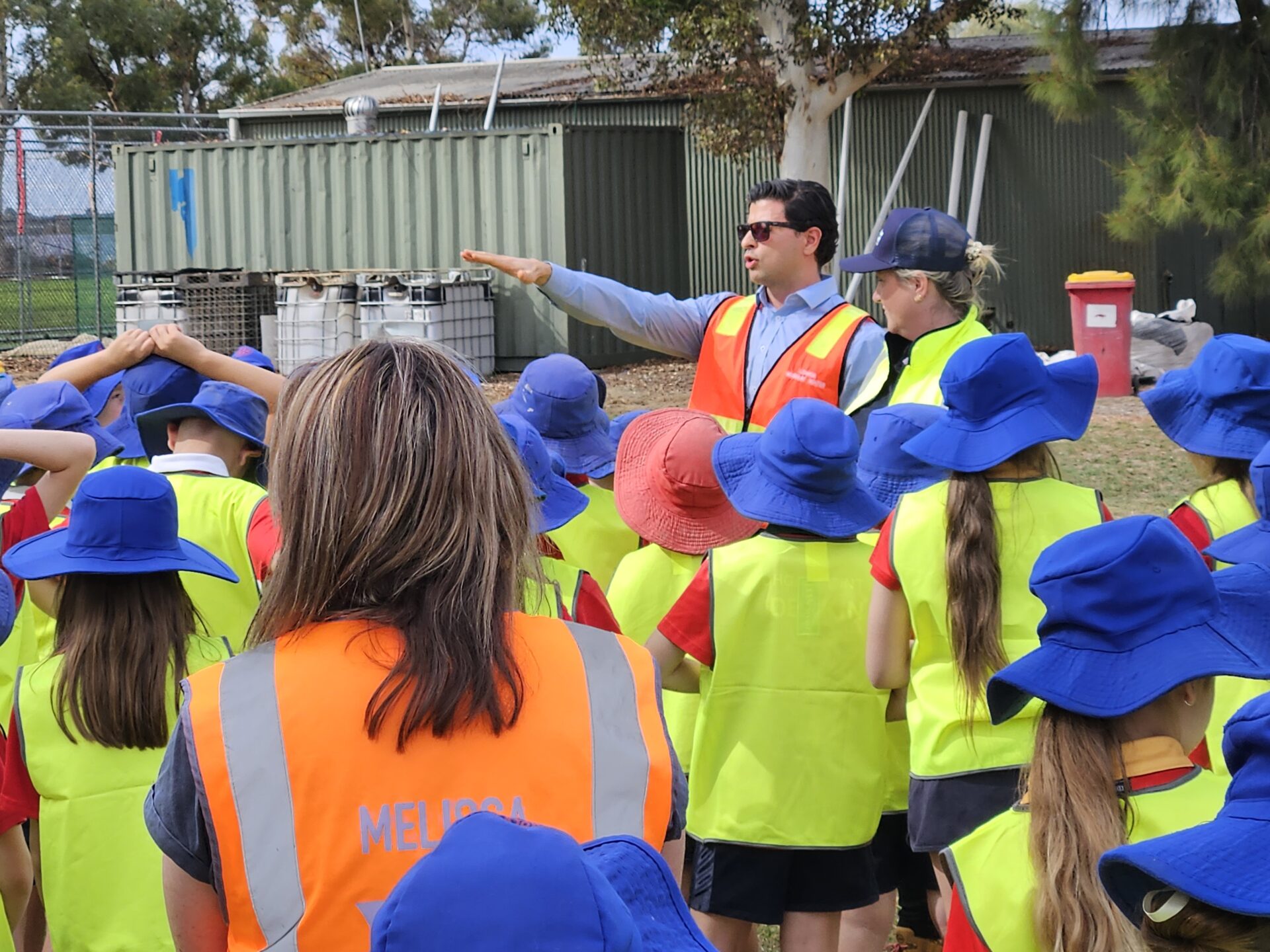 SWEP project manager, Ahmed showing the Nichols Point Primary School students the worksite 