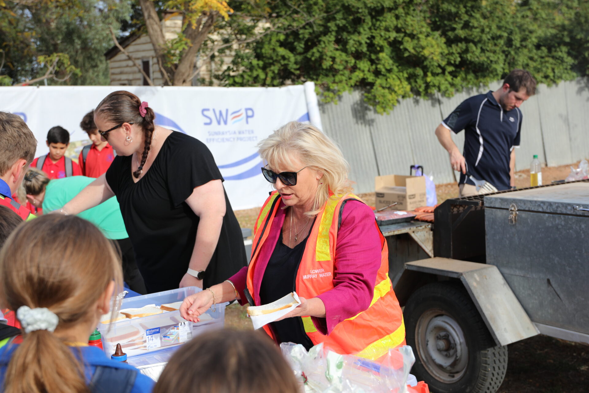 LMW board chair Sharyon Peart helping serve the hungry guests at the Meet the team event 